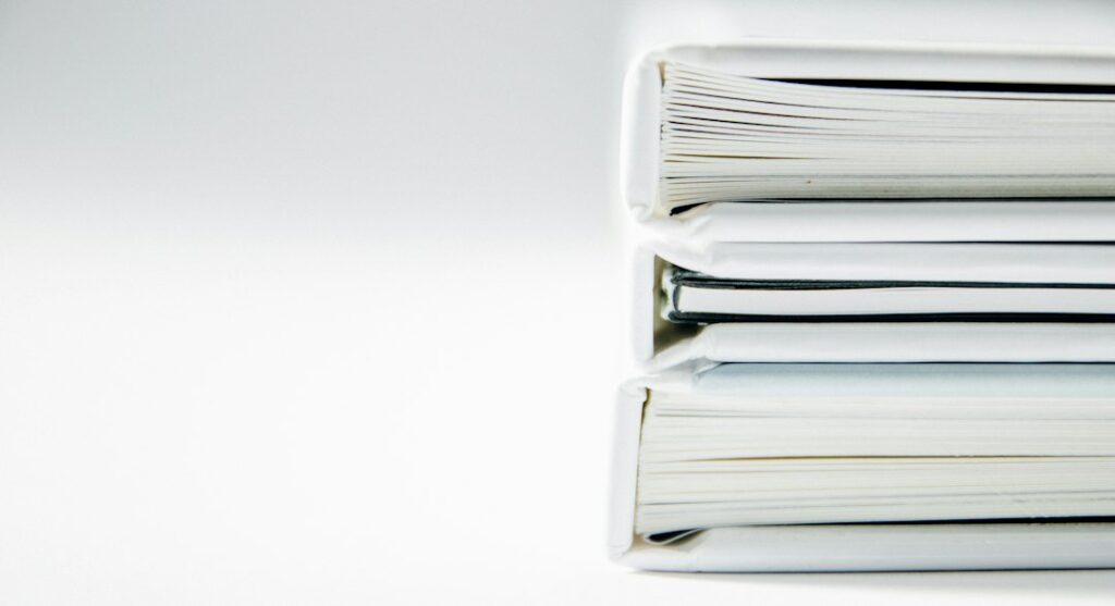 Stack of folders representing family property and succession records