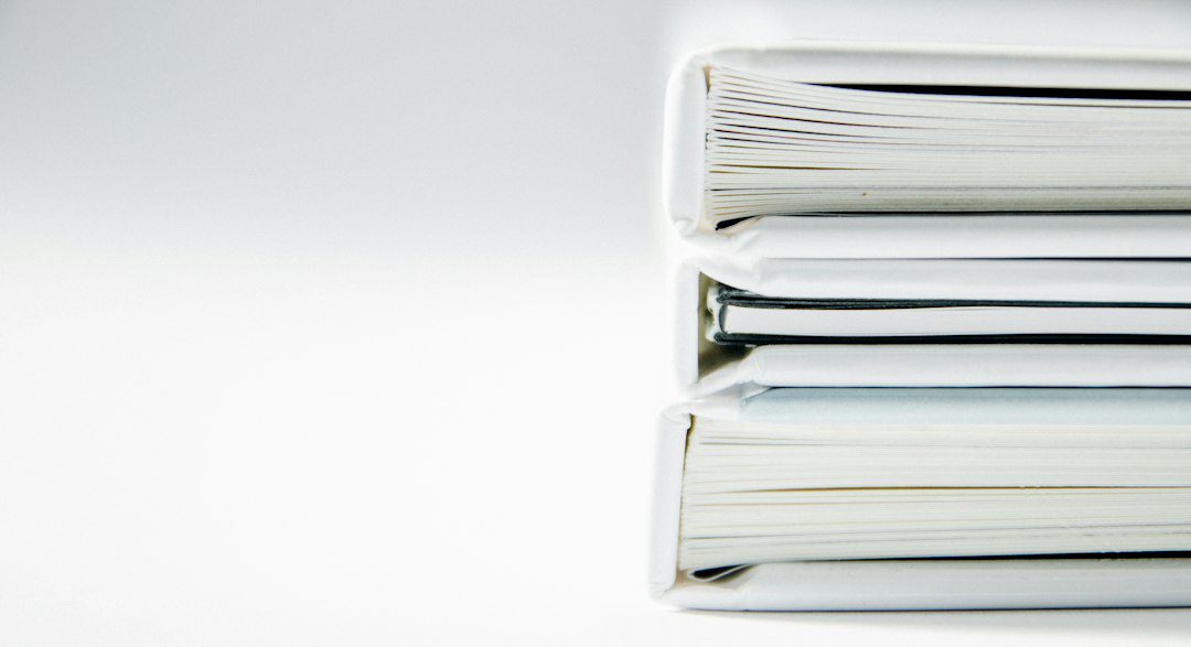 Stack of folders representing family property and succession records